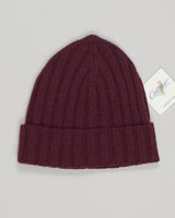 Sumptuous cashmere beanie in burgundy. Lightweight construction offers warmth without bulk, ideal for layering or standalone wear. Soft, breathable fiber maintains its shape through seasons. Perfect for refined everyday elegance. Calimar Light Cashmere Beanie / Burgundy