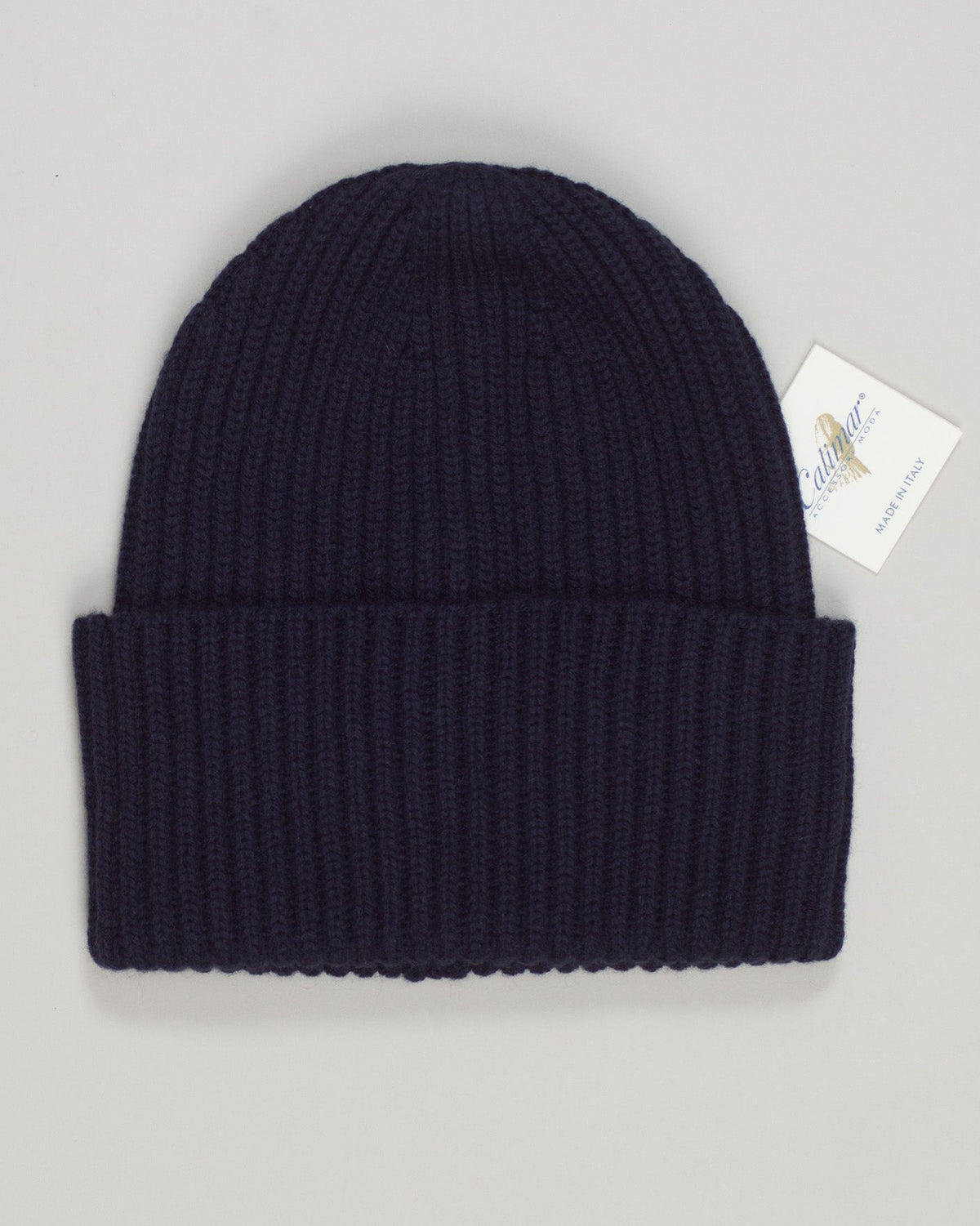 Calimar cashmere beanie in deep navy. Luxurious 100% cashmere construction offers unmatched softness and warmth. Refined ribbed knit with a clean, minimalist aesthetic that pairs effortlessly with any wardrobe. Timeless design built for everyday elegance and lasting comfort. A versatile essential for those who appreciate quality knitwear. Calimar Cashmere Beanie / Navy