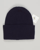Calimar cashmere beanie in deep navy. Luxurious 100% cashmere construction offers unmatched softness and warmth. Refined ribbed knit with a clean, minimalist aesthetic that pairs effortlessly with any wardrobe. Timeless design built for everyday elegance and lasting comfort. A versatile essential for those who appreciate quality knitwear. Calimar Cashmere Beanie / Navy