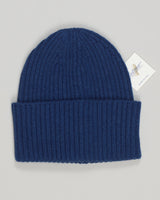 Pure cashmere beanie in a refined indigo hue. Soft, breathable knit that moves with you through seasons. Simple, timeless design that pairs effortlessly with any wardrobe. Lightweight enough for layering or worn alone on cooler days. A luxury essential that transcends trends. Calimar Cashmere Beanie / Indigo