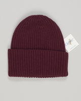 Crafted from pure cashmere, this burgundy beanie delivers luxurious softness and warmth with effortless sophistication. The refined construction ensures durability through seasons of wear, while the classic silhouette complements any wardrobe. An investment piece that balances comfort with understated elegance. Calimar Cashmere Beanie / Burgundy