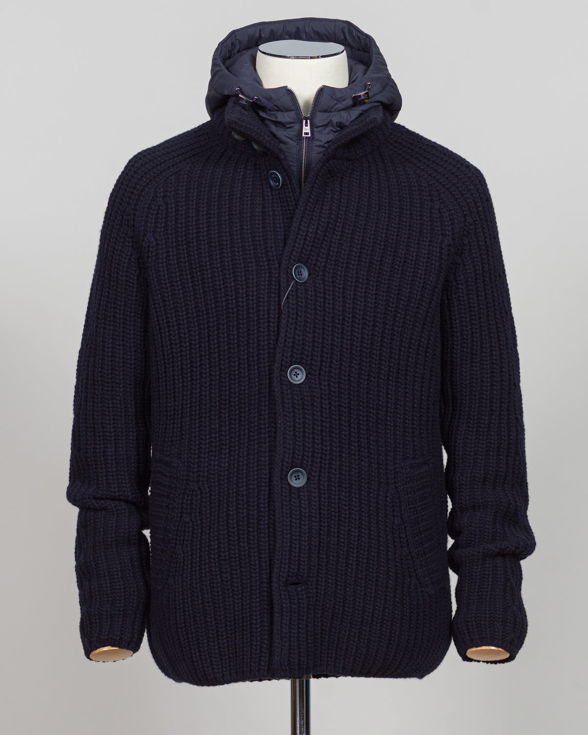 Herno's lined cardigan in navy combines Italian craftsmanship with refined minimalism. Constructed from premium wool with a structured silhouette, the interior lining ensures comfort through layering or as a standalone piece. The clean lines and versatile navy tone work seamlessly with tailored trousers or casual wear, making it an essential addition to a modern menswear wardrobe. Perfect for transitional seasons or layering year-round.