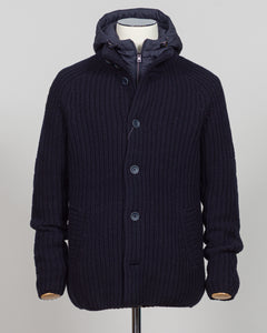 Herno's lined cardigan in navy combines Italian craftsmanship with refined minimalism. Constructed from premium wool with a structured silhouette, the interior lining ensures comfort through layering or as a standalone piece. The clean lines and versatile navy tone work seamlessly with tailored trousers or casual wear, making it an essential addition to a modern menswear wardrobe. Perfect for transitional seasons or layering year-round.