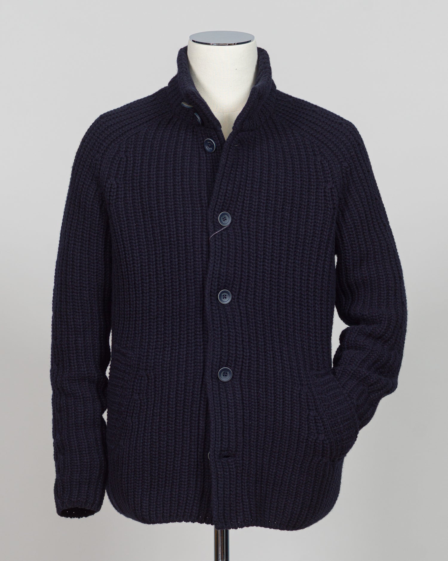 Herno's lined cardigan in navy combines Italian craftsmanship with refined minimalism. Constructed from premium wool with a structured silhouette, the interior lining ensures comfort through layering or as a standalone piece. The clean lines and versatile navy tone work seamlessly with tailored trousers or casual wear, making it an essential addition to a modern menswear wardrobe. Perfect for transitional seasons or layering year-round.