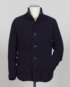 Herno's lined cardigan in navy combines Italian craftsmanship with refined minimalism. Constructed from premium wool with a structured silhouette, the interior lining ensures comfort through layering or as a standalone piece. The clean lines and versatile navy tone work seamlessly with tailored trousers or casual wear, making it an essential addition to a modern menswear wardrobe. Perfect for transitional seasons or layering year-round.