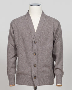 A gray knit cardigan sweater displayed on a white mannequin torso against a light gray studio background. The cardigan has a V-neck, front button closure with dark brown buttons, ribbed cuffs, and ribbed hem.  Gran Sasso's timeless cashmere crew neck in soft beige epitomizes understated luxury. Crafted from 100% pure cashmere with a vintage-washed finish that develops character with wear, this Italian-made essential features a relaxed fashion fit, ribbed detailing at the hem and cuffs, and a refined crew ne