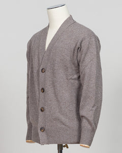 A heather gray knit cardigan sweater displayed on a white mannequin torso against a light gray studio background.  Gran Sasso's timeless cashmere crew neck in soft beige epitomizes understated luxury. Crafted from 100% pure cashmere with a vintage-washed finish that develops character with wear, this Italian-made essential features a relaxed fashion fit, ribbed detailing at the hem and cuffs, and a refined crew neckline. An investment piece that anchors any wardrobe. Gran Sasso Cashmere Crew Neck / Beige