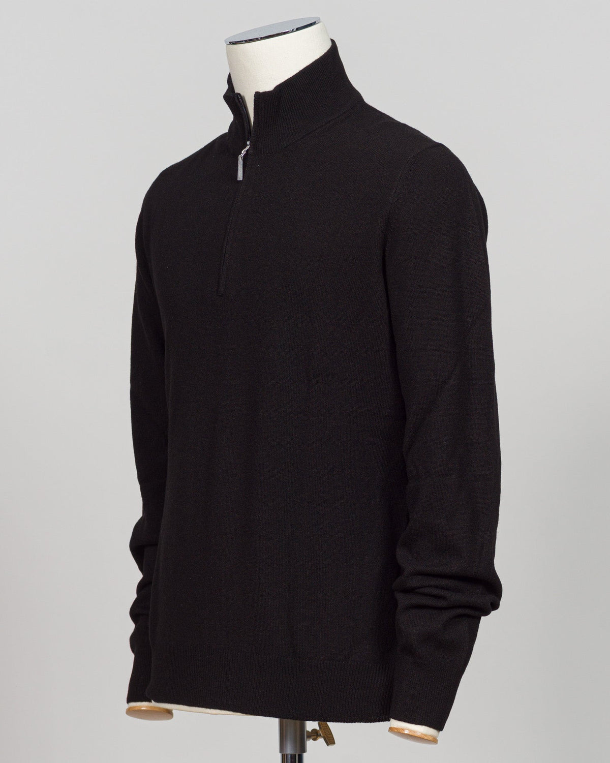 A refined half-zip in Gran Sasso's signature blend of wool and cashmere. The substantial knit drapes with understated elegance in classic black, offering versatility across layered dressing and standalone wear. Designed for the discerning wardrobe that values both comfort and craftsmanship. Gran Sasso Wool & Cashmere Half-Zip / Black