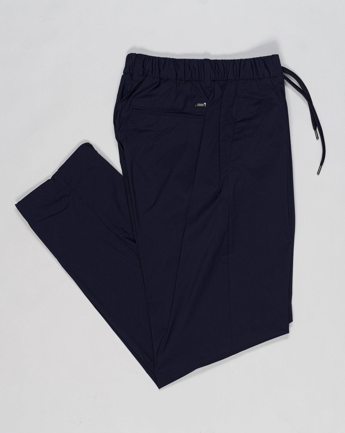 Elastic with drawstring waist
Beltloops
Zip and button fastening
Slanted pockets
Welted pockets on the back
Material: 86%pa 14%ea
Article: PT000193U-12431SZ
Color: 9201 / Blue
Made in Republic of Moldova Herno Nylon Stretch Trousers / Blue