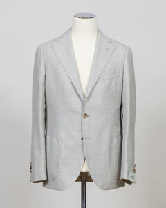 Single breasted
Notch lapel
Two buttons in front
Four sleeve buttons
Welted chest pocket
Patch side pockets
Modello: Sorrento
Hand finished&nbsp;
Half canvas
Half lined
Composition: 100% Virgin Wool
Article: G271012
Col. Light Grey
Made in Napoli, Italy Luigi Borrelli Hopsack Jacket / Light Grey