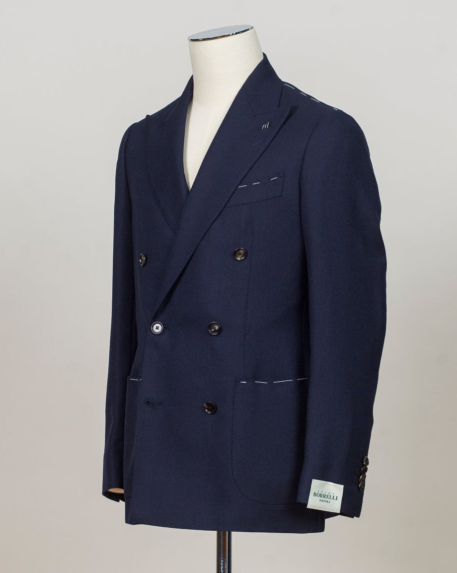 Double breasted, 6 buttons
Peak lapel
Four sleeve buttons
Welted chest pocket
Patch side pockets
Modello: Sorrento
Hand finished&nbsp;
Half canvas
Half lined
Composition: 100% wool
Article: G271012
Col. Navy blue
Made in Napoli, Italy Luigi Borrelli Double Breasted Jacket / Navy