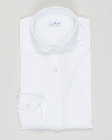 Timeless cotton jersey shirt in crisp white. Soft, breathable fabric with a relaxed fit perfect for layering or standalone wear. Italian craftsmanship meets everyday versatility—an essential for any refined wardrobe. Sonrisa Cotton Jersey Shirt / White