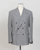 New York 1SNY10B 
Double-breasted
Peak lapel
One vent / centerback
2 Patch pockets
100% wool
Art 630017
Col N1308 / Black & white
Made in Martina Franca, Italy Tagliatore Double-Breasted Houndstooth Jacket / Black & White