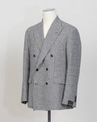 New York 1SNY10B 
Double-breasted
Peak lapel
One vent / centerback
2 Patch pockets
100% wool
Art 630017
Col N1308 / Black & white
Made in Martina Franca, Italy Tagliatore Double-Breasted Houndstooth Jacket / Black & White