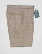 Model: Chiaia long
Single pleat
Front pockets: seam
Back pockets: welted
Hemming: 5cm turn ups
Article: ca2034
Color: Brown
Composition: 100% Virgin wool natural stretch
Made in Martina Franca, Italy Berwich Puppytooth Trousers / Beige