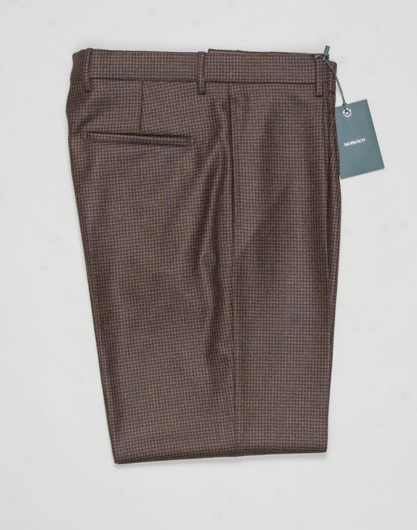 Model: Chiaia long
Single pleat
Front pockets: seam
Back pockets: welted
Hemming: 5cm turn ups
Article: ca2034
Color: Brown
Composition: 100% Virgin wool natural stretch
Made in Martina Franca, Italy Berwich Puppytooth Trousers / Brown