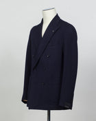 Composition: 40% Polyester 30% Virgin wool 30% Acrylic
Lining: 100% Cupro
Modello: Monte Carlo / 1SHJ20K
Color: Navy / B3459
Unconstructed shoulder
Unlined
6 Buttons
Peak lapel
Patch pockets
Side vents
Made in Martina Franca, Italy Tagliatore Double-Breasted Jersey Jacket / Navy