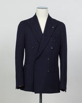 Composition: 40% Polyester 30% Virgin wool 30% Acrylic
Lining: 100% Cupro
Modello: Monte Carlo / 1SHJ20K
Color: Navy / B3459
Unconstructed shoulder
Unlined
6 Buttons
Peak lapel
Patch pockets
Side vents
Made in Martina Franca, Italy Tagliatore Double-Breasted Jersey Jacket / Navy