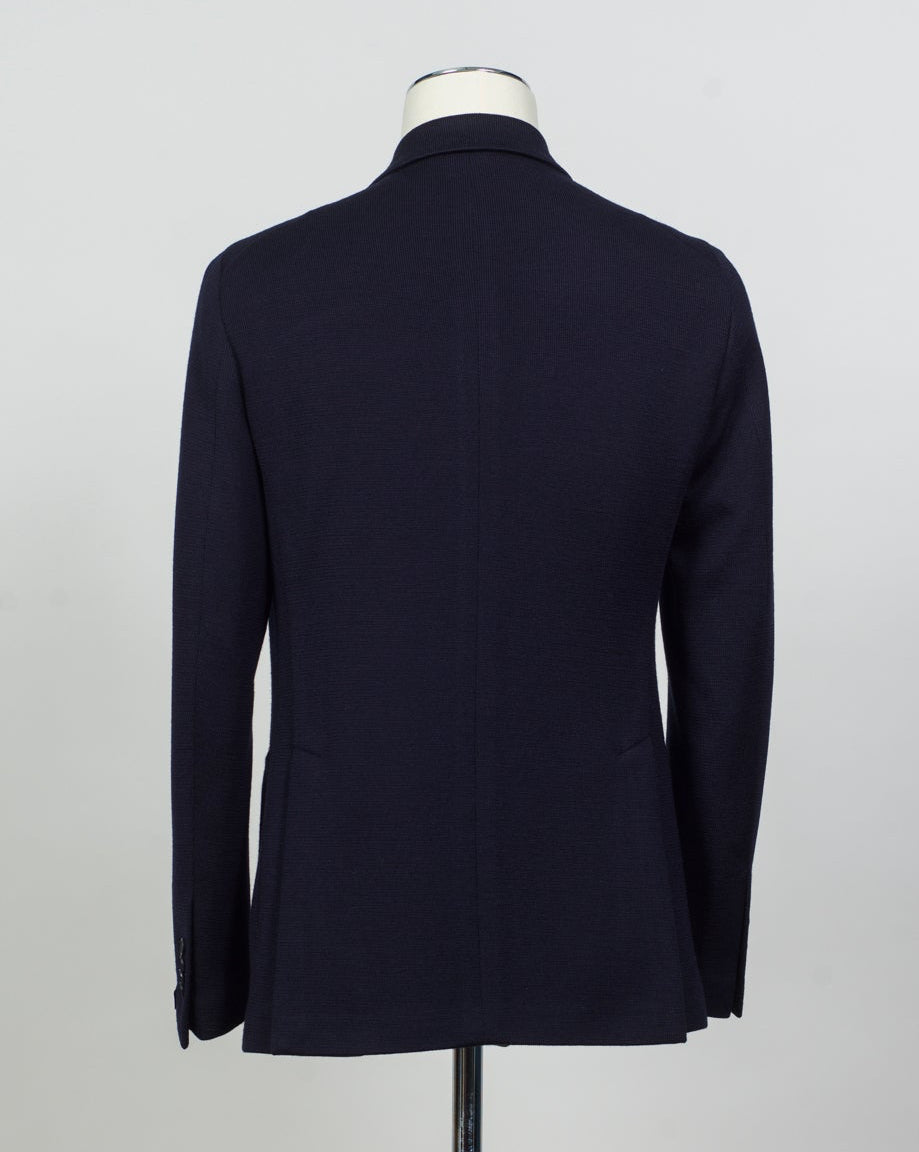 Composition: 40% Polyester 30% Virgin wool 30% Acrylic
Lining: 100% Cupro
Modello: Monte Carlo / 1SHJ20K
Color: Navy / B3459
Unconstructed shoulder
Unlined
6 Buttons
Peak lapel
Patch pockets
Side vents
Made in Martina Franca, Italy Tagliatore Double-Breasted Jersey Jacket / Navy