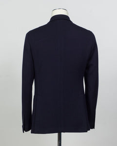 Composition: 40% Polyester 30% Virgin wool 30% Acrylic
Lining: 100% Cupro
Modello: Monte Carlo / 1SHJ20K
Color: Navy / B3459
Unconstructed shoulder
Unlined
6 Buttons
Peak lapel
Patch pockets
Side vents
Made in Martina Franca, Italy Tagliatore Double-Breasted Jersey Jacket / Navy