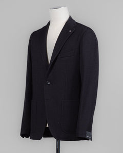 Composition: 40% Polyester 30% Virgin Wool 30% Acrylic
Modello: Monte Carlo / 1SMJ22K
Color: Black / N3342
Unconstructed shoulder
Unlined
2 Buttons
Notch lapel
Patch pockets
Side vents
Made in Martina Franca, Italy Tagliatore Jersey Knit Jacket / Black