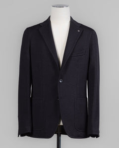 Composition: 40% Polyester 30% Virgin Wool 30% Acrylic
Modello: Monte Carlo / 1SMJ22K
Color: Black / N3342
Unconstructed shoulder
Unlined
2 Buttons
Notch lapel
Patch pockets
Side vents
Made in Martina Franca, Italy Tagliatore Jersey Knit Jacket / Black