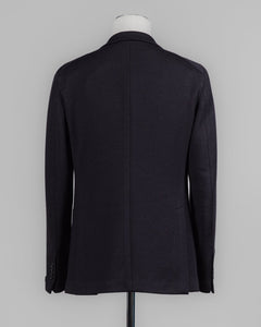 Composition: 40% Polyester 30% Virgin Wool 30% Acrylic
Modello: Monte Carlo / 1SMJ22K
Color: Black / N3342
Unconstructed shoulder
Unlined
2 Buttons
Notch lapel
Patch pockets
Side vents
Made in Martina Franca, Italy Tagliatore Jersey Knit Jacket / Black