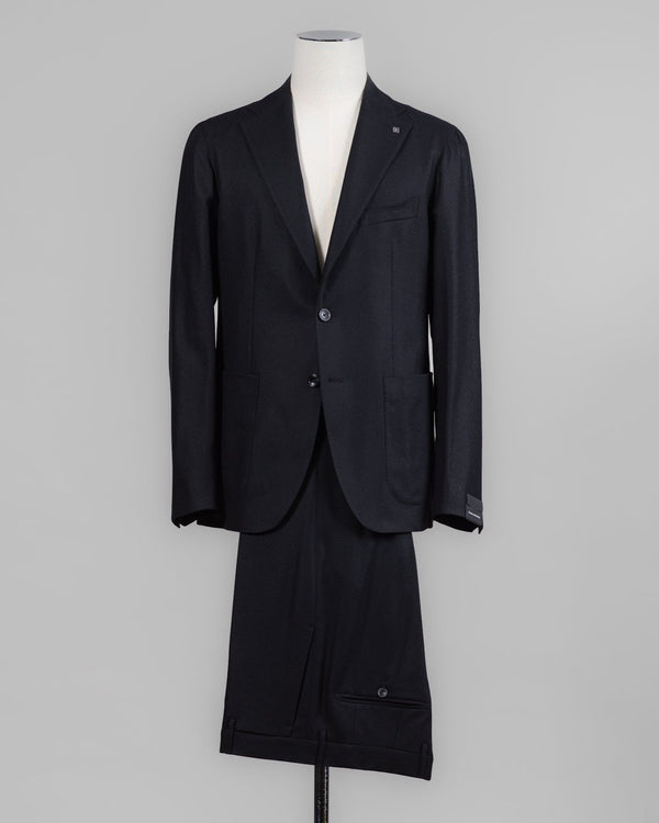 Composition: 99% Virgin wool Super 100's 1% Elastane
Modello: Monte Carlo / 2SMC22K01
Color: Black / N1124
Unconstructed shoulder
Unlined
2 Buttons
Notch lapel
Patch pockets
Side vents
Belt loops
Flat front
Made in Martina Franca, Italy Tagliatore Flannel Suit / Black