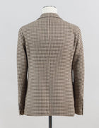 Modello: Monte Carlo / 1SMC22K
Color: Light Brown / EM836
Unconstructed shoulder
Unlined
2 Buttons
Notch lapel
Patch pockets
Side vents
Made in Martina Franca, Italy Tagliatore Houndstooth Jersey Jacket / Light Brown
