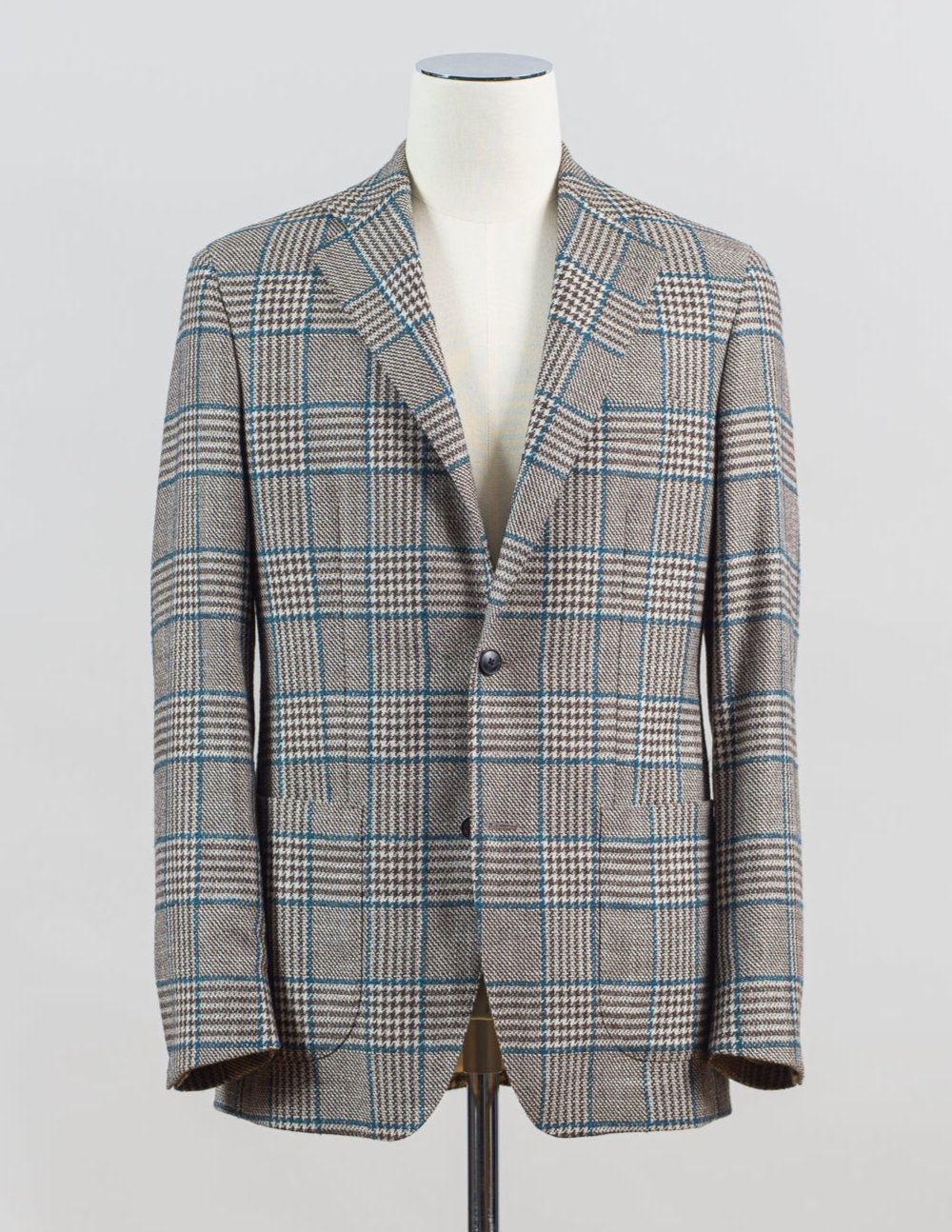 Composition: 88% Wool 12% Silk
2 buttons
side vents
notch lapel
fully lined Sauma Wool & Silk Glencheck Jacket / Brown