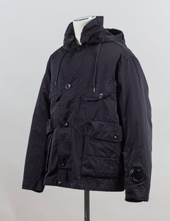 External fabric: 66% Polyester 34% Polyamide
Lens detail on left sleeve

Real Corozo buttons
Article: 17CMOW224A 110089G
Color: Black / 999
Detachable down layer
External Fabric: 100% Polyamide
Lining: 100% Polyamide
Filling: 90% Grey duck down 10% feather C.P Company Micro Kei La Mille Jacket / Black