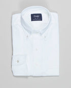 The oxford cloth button-down shirt is an enduring icon of menswear, which looks as good now as it did a century ago. It's an item that's at the very heart of our brand, and this is our attempt at perfecting the style. With a regular silhouette, floating interlinings, single-needle construction, and - perhaps most importantly - an elegant rolling collar, it's a shirt for all occasions.

100% Cotton
Made in Our Factory in Somerset, England
Button-Down Collar with Brushed, Floating Interlining
Box Pleat
Single