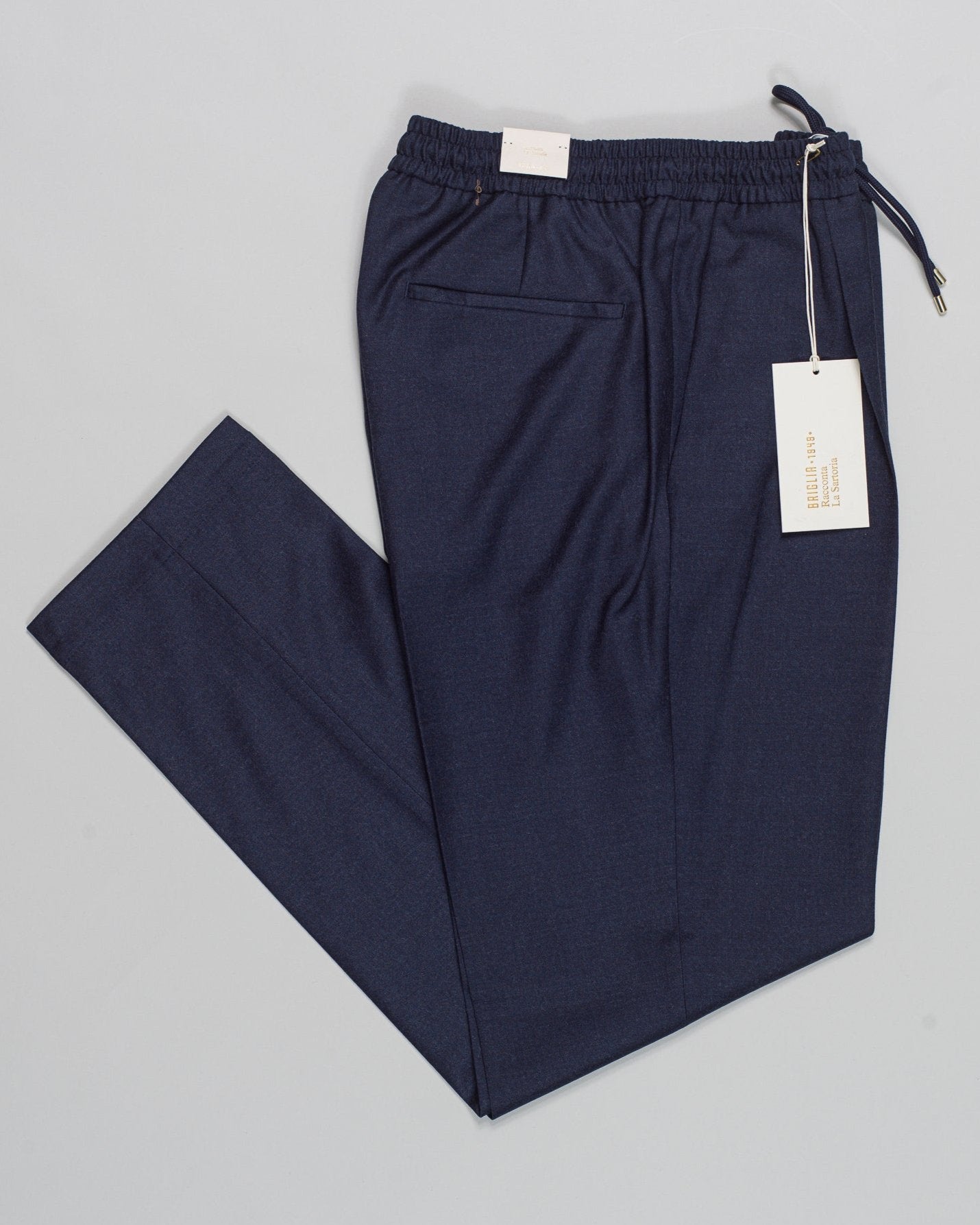 Article: 424120
Model: Wimbledons
Color: Blue / 91
Composition: 99% Virgin Wool 1% Elastan
One Pleat
Slanted side pockets
Drawstring waist

Made in Naples, Italy Briglia Drawstring Flannel Trousers / Blue