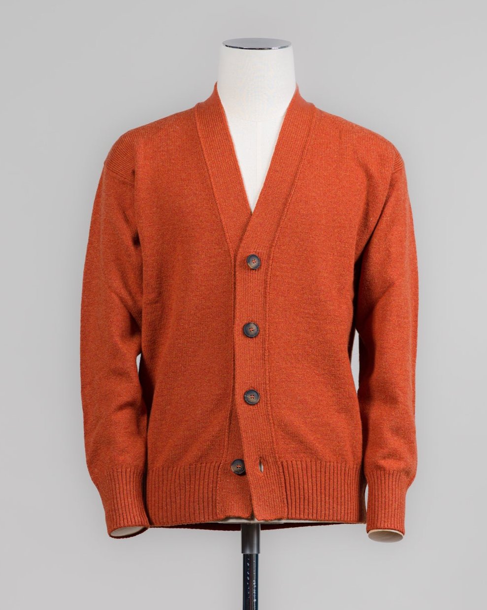 Super Geelong wool cardigan featuring dropped shoulder and 4-button closure. Versatile and refined, it's a timeless wardrobe staple. For its unparalleled softness, this item is a luxury treat. Made in Italy.

Article: 23188/25051
Color: 373 / Orange
Composition: 100% Virgin Wool
Super Geelong
Made in Italy &nbsp;Gran Sasso Wool Cardigan / Orange