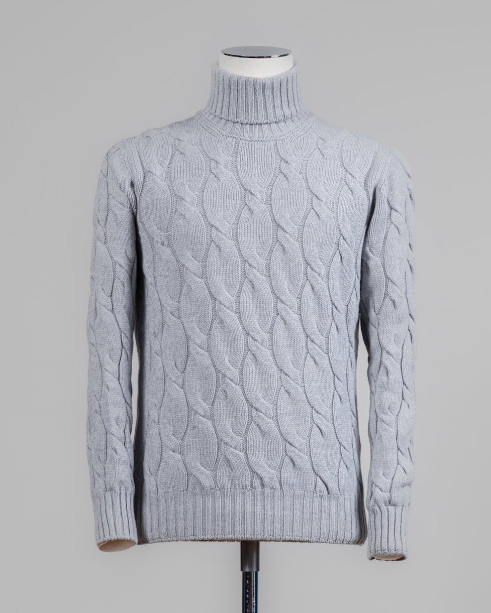 Classic version of a heavy roll neck with a beautiful knitted cable pattern. Warm and comfortable for the cold season.

Article: 13115/19659
Color: 061 / Light Grey
Composition: 80% Virgin Wool 10% Cashmere 10% Viscose

Made in Italy Gran Sasso Cable Knit Roll Neck / Light Grey
Article: 13115/19659
Color: 061 / Light Grey
Composition: 80% Virgin Wool 10% Cashmere 10% Viscose

Made in Italy Gran Sasso Cable Knit Roll Neck / Light Grey