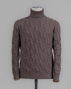 Classic version of a heavy roll neck with a beautiful knitted cable pattern. Warm and comfortable for the cold season.

Article: 13115/19659
Color: 184 / Brown
Composition: 80% Virgin Wool 10% Cashmere 10% Viscose

Made in Italy Gran Sasso Cable Knit Roll Neck / Brown