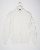 Classic version of a heavy roll neck with a beautiful knitted cable pattern. Warm and comfortable for the cold season.

Article: 13115/19659
Color: 001 / White
Composition: 80% Virgin Wool 10% Cashmere 10% Viscose

Made in Italy Gran Sasso Cable Knit Roll Neck / White