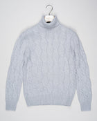 Classic version of a heavy roll neck with a beautiful knitted cable pattern. Warm and comfortable for the cold season.

Article: 13115/19659
Color: 061 / Light Grey
Composition: 80% Virgin Wool 10% Cashmere 10% Viscose

Made in Italy Gran Sasso Cable Knit Roll Neck / Light Grey