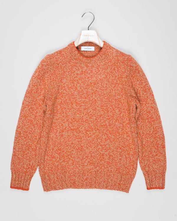 Crew neck knit with a up-to-date, two toned&nbsp; melangé pattern. Fibers of geelong lambswool are extra crimped and curly. This makes it extremely soft, warm and comfortable to wear.

Article: 10158/25701
Color:&nbsp; 844 / Orange &amp; Beige
Composition: 100% Virgin Wool (Super Geelong)

Made in Italy Gran Sasso Two-tone Wool Crew Neck / Orange