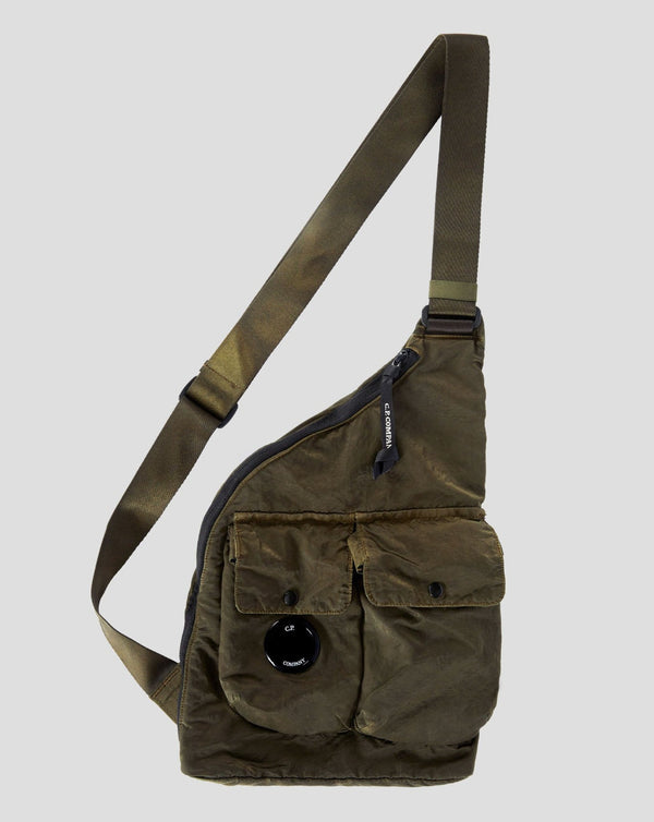 Zipped main compartment Secure auxiliary pockets Lens detail Adjustable strap Weather-resistant Garment dyed Art 15CMAC114A-005269G Col. 683 / Ivy Green C.P. Company Nylon B Single Strap Rucksack / Ivy Green