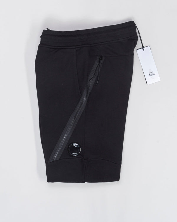 Art. 15CMSP084A 005086W Col. 999 Black 100% Cotton Adjustable drawstring waistband Slanted hand pockets Zipped side pockets Ribbed leg opening Lens detail C.P. Company Diagonal Raised Fleece Zipped Track Pants / Black