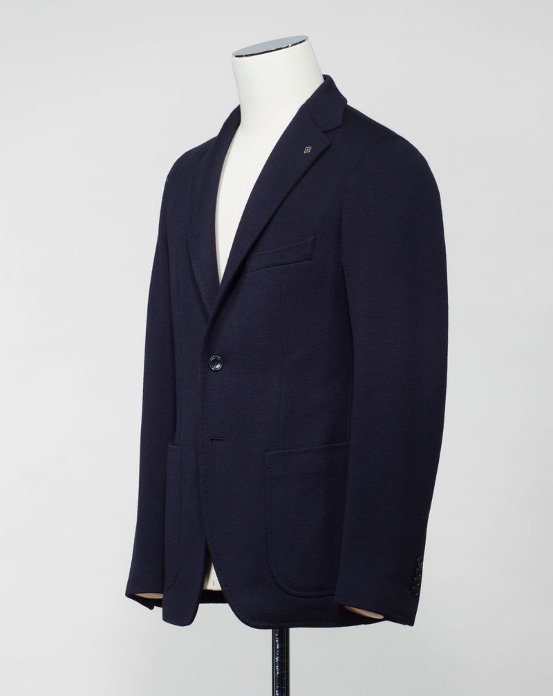 Model: 1SMC22K  Article: 340209 J Unlined  Unconstructed shoulder  Composition: 40% Polyester 30% Virgin Wool 30% Acrylic Color: B1109 / Navy Made in Martina Franca, Italy Tagliatore Knit Jersey Jacket / Navy
