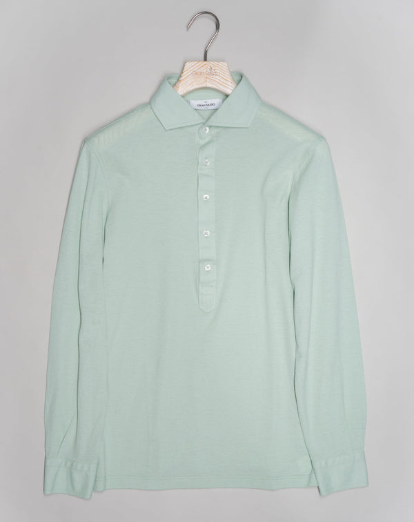 Less formal than a button-down but more dressy than a polo. Popover is a great combination of a dress shirt and a polo shirt. Menswear hybrid that is here to stay if you ask us.   Gran Sasso Popover Long Sleeves Article: 60180 / 81427 Color: 415 / Light Green Made in Italy Gran Sasso Cotton Pop-Over Shirt / Light Green