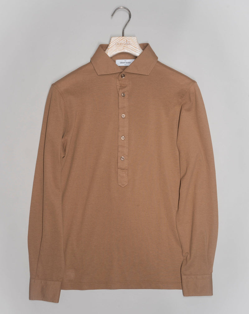 Less formal than a button-down but more dressy than a polo. Popover is a great combination of a dress shirt and a polo shirt. Menswear hybrid that is here to stay if you ask us.   Gran Sasso Popover Long Sleeves Article: 60180 / 81427 Color: 157 / Tobacco Made in Italy Gran Sasso Cotton Pop-Over Shirt / Tobacco