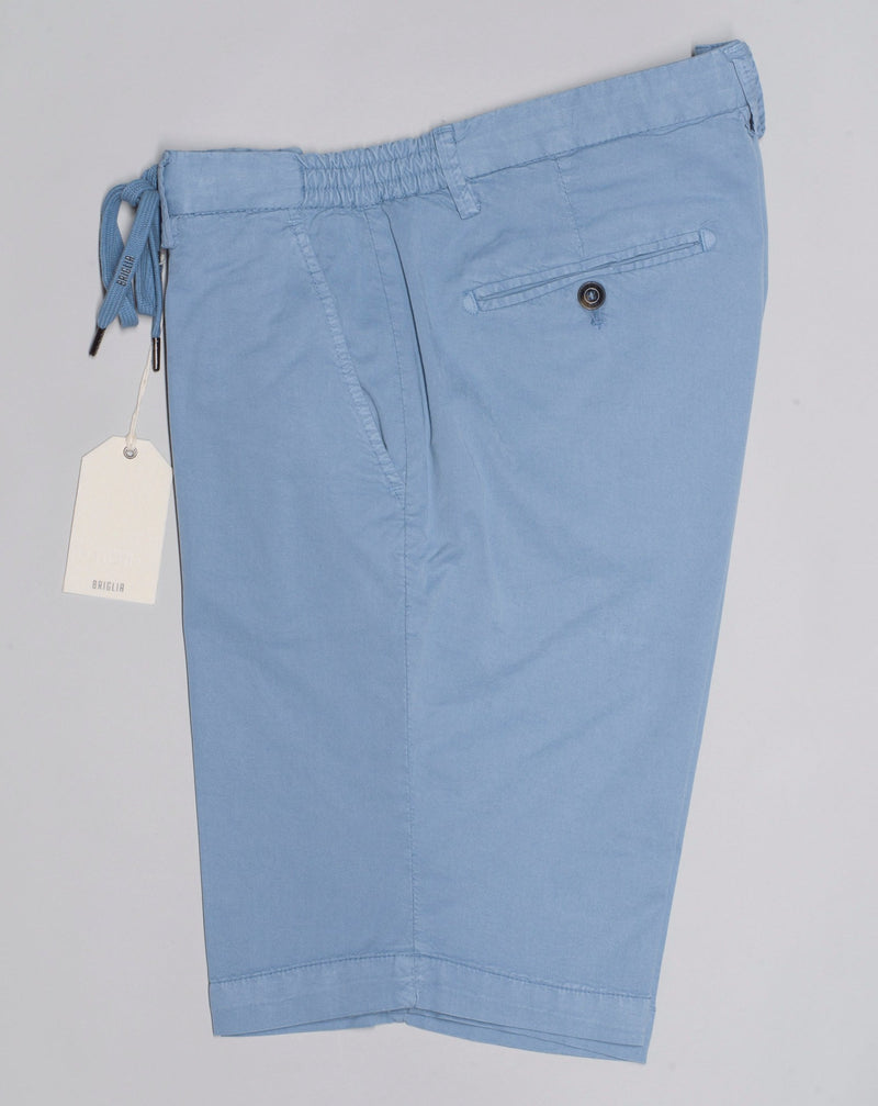 Briglia casual bermudas with drawstrings and elastic adjustments on both sides. Style: Malibu Art 323051 Composition:   64% Tencel, 32% Cotton, 4% Elastan Color: 41 / Light Blue Flat front with drawstrings  Elastic  integrated adjuster on both side Made in Naples, Italy