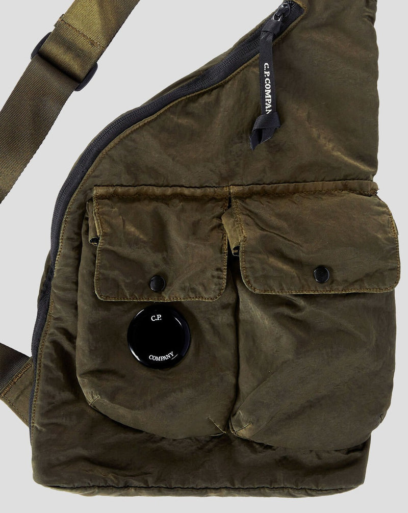 Zipped main compartment Secure auxiliary pockets Lens detail Adjustable strap Weather-resistant Garment dyed Art 15CMAC114A-005269G Col. 683 / Ivy Green C.P. Company Nylon B Single Strap Rucksack / Ivy Green