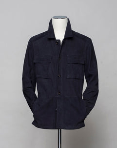 <ul> <li>Composition: 100% Leather (Goatskin)</li> <li>Horn Buttons</li> <li>Color: 575 / Dark Navy</li> <li>Style: Henri</li> </ul>