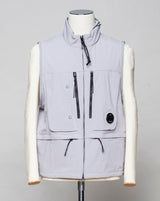 <ul> <li>Zip fastening in front. Two way zip.</li> <li>4 zipped pockets in front</li> <li>2 small pockets with snap fasteners in front</li> <li>1 pocket inside</li> <li>Adjustable hem</li> <li>Light weight hood inside collar</li> <li>Article: 16CMOW105A 005968A</li> <li>Composition: 92% Polyester 8% Elastan</li> <li>Color: 913 / Drizzle grey</li> <li>C.P. Company CP Shell Vest / Drizzle Grey</li> </ul>