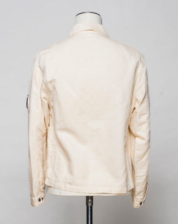 <ul> <li>Button fastening in front</li> <li>3 patch pocekts in front</li> <li>2 slanted pockets with snap fasteners in front</li> <li>1 inside pocket with snap fastener</li> <li>Article: 16CMOS277A 006273G</li> <li>Composition: 60% Cotton 40% Linen</li> <li>Color: 402 / Pistachio Shell (Crema)</li> </ul>