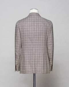 <ul> <li>Unconstructed shoulder</li> <li>Half lined</li> <li>3 roll 2 buttons</li> <li>2 patch pockets</li> <li>Side vents</li> <li>Composition: 100% Silk</li> <li>Model: Posilipo</li> <li>Article: TS24068</li> <li>Color: 7270 / Brown &amp; Green</li> <li>Drop 7</li> <li>Made in Italy</li> </ul>